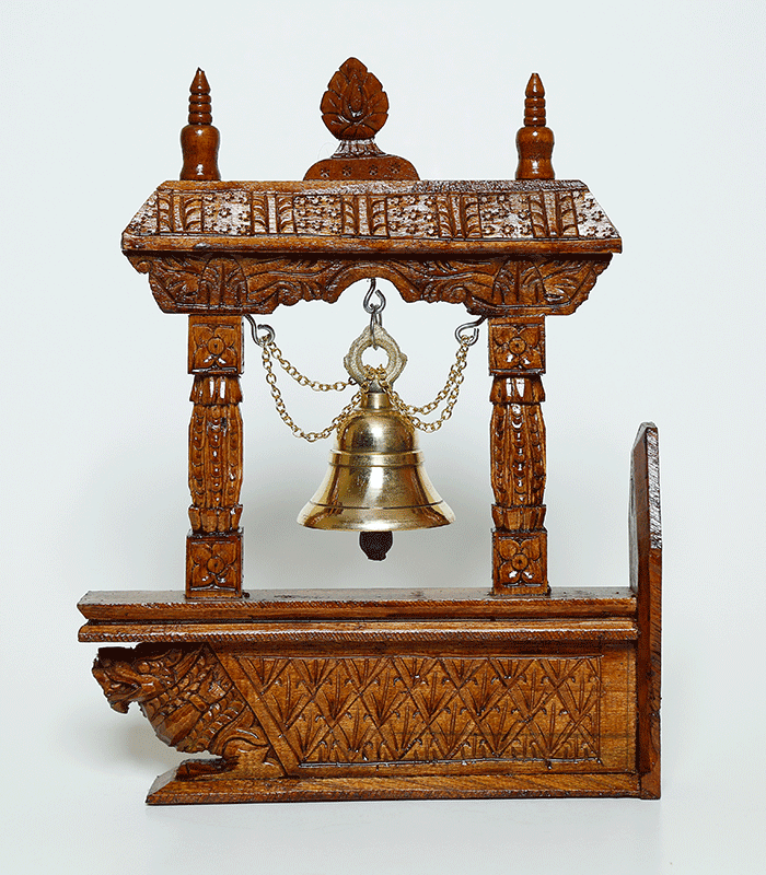 Close-up view of the intricate wood carvings on the Timeless Artisan Hanging Bell with Key Hooks, inspired by Nepalese temple artistry.