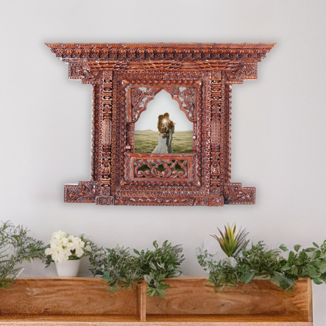 Handcrafted Kumari Jhyal wooden frame with open doors displaying a wedding couple, ideal for wedding keepsakes and heritage décor.