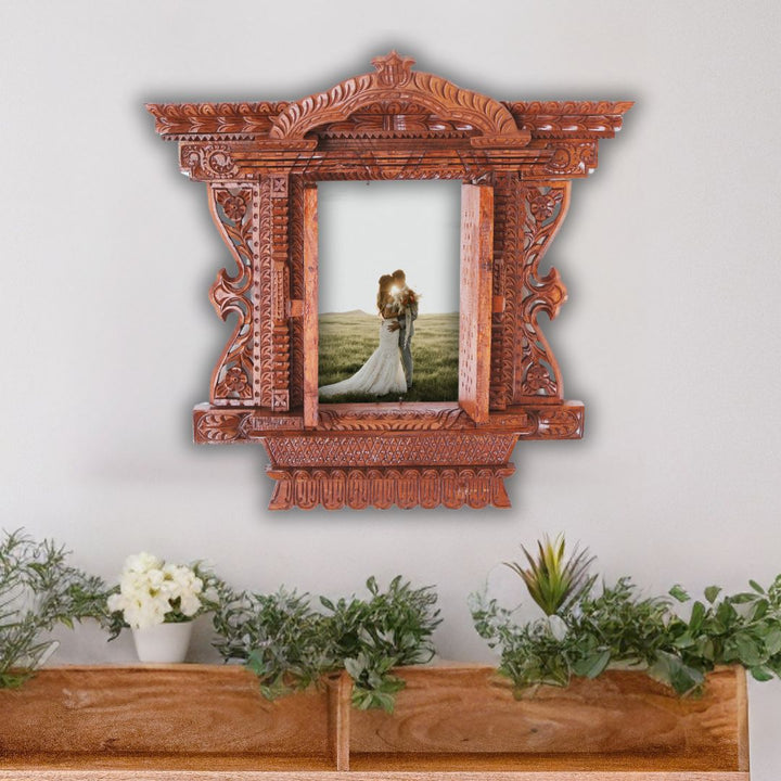 Handcrafted Kumari Jhyal wooden frame with open doors displaying a wedding couple, ideal for wedding keepsakes and heritage décor.